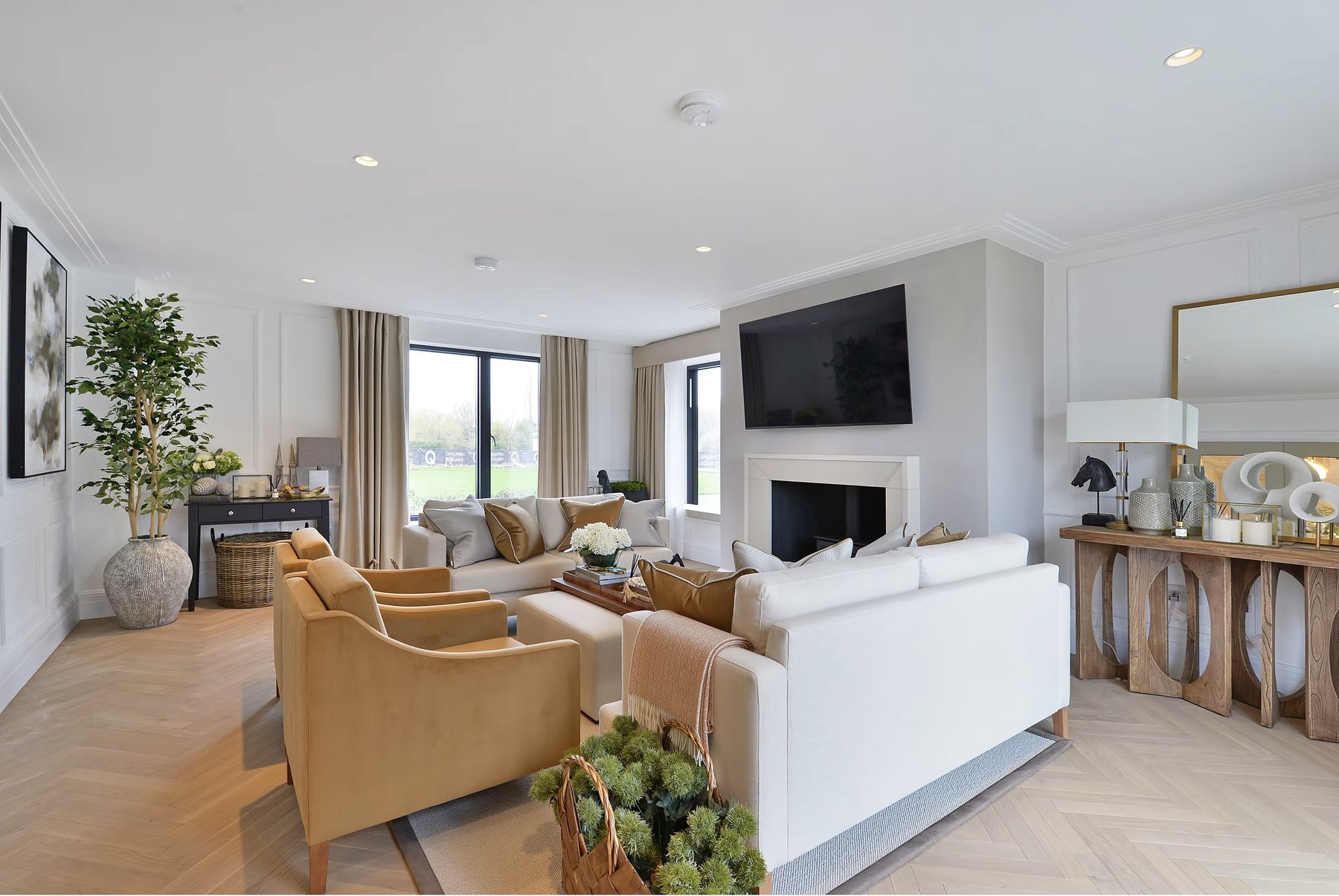 Alfold Gardens completed living room with fireplace, herringbone flooring and neutral palette, Surrey — by HDEY