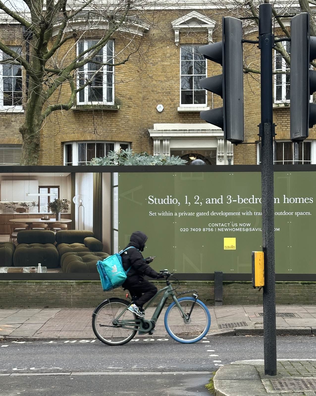 Angel Village site hoarding with development details and interior CGI imagery, Islington — by HDEY