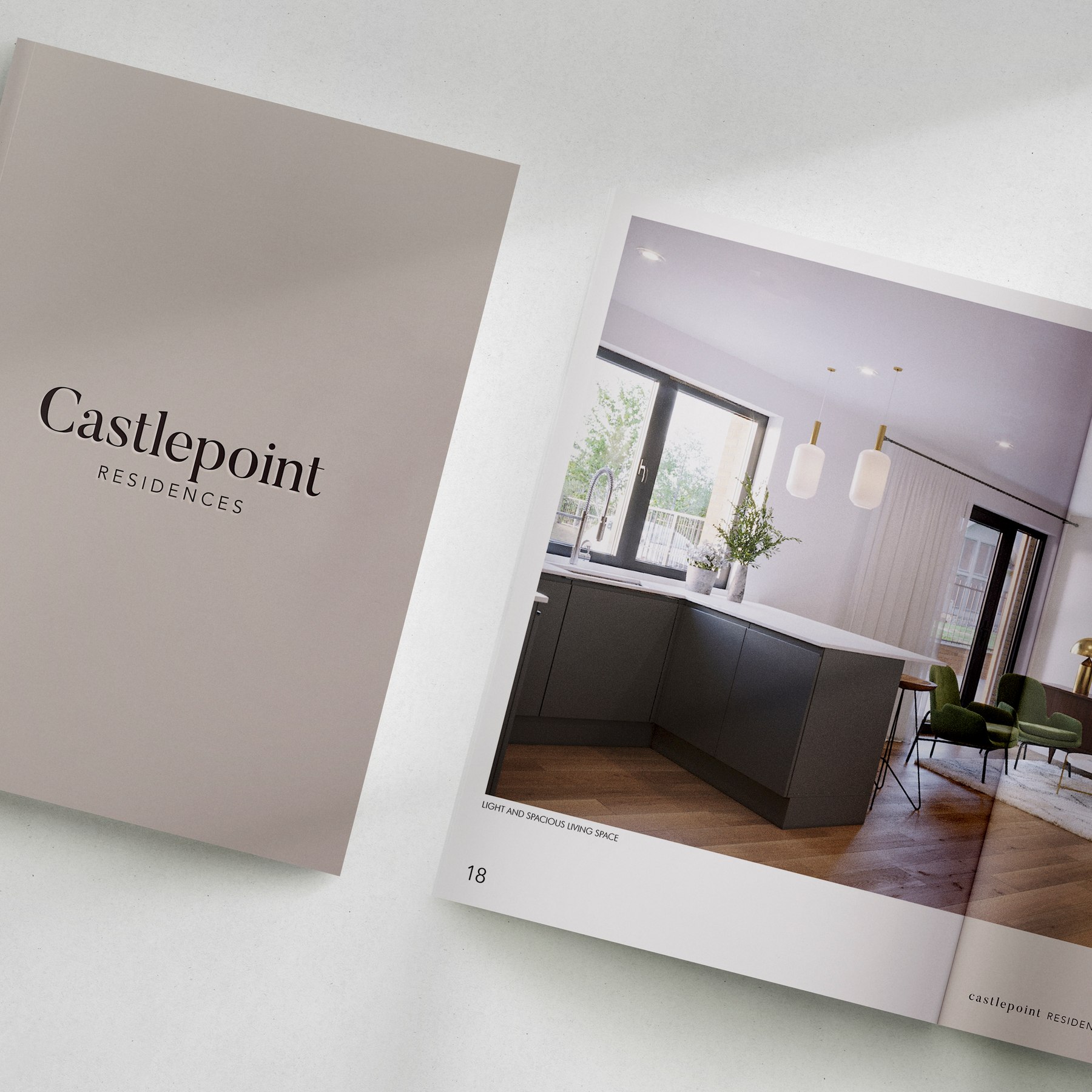 Castlepoint Residences brochure cover in greige with the logotype, alongside a living space spread, print design by HDEY