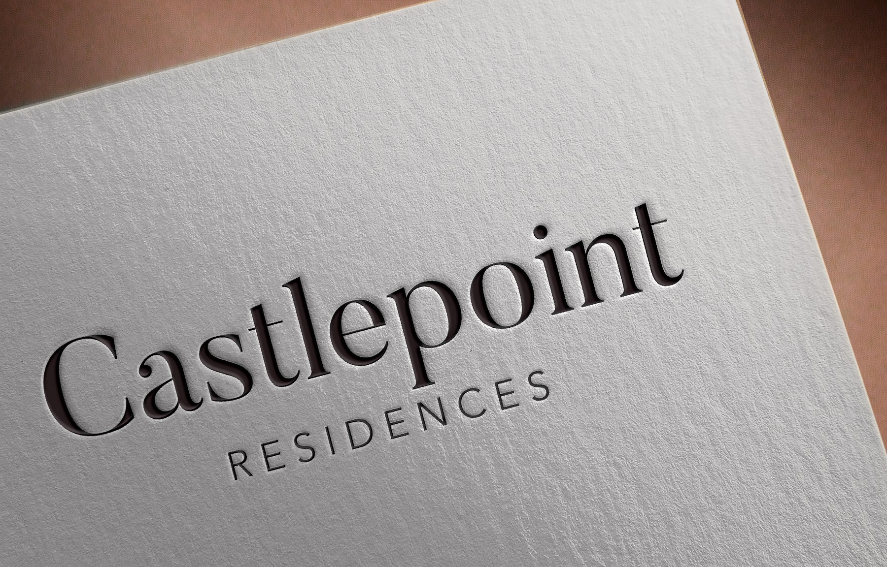 Castlepoint Residences logotype shown on uncoated stock, brand identity by HDEY