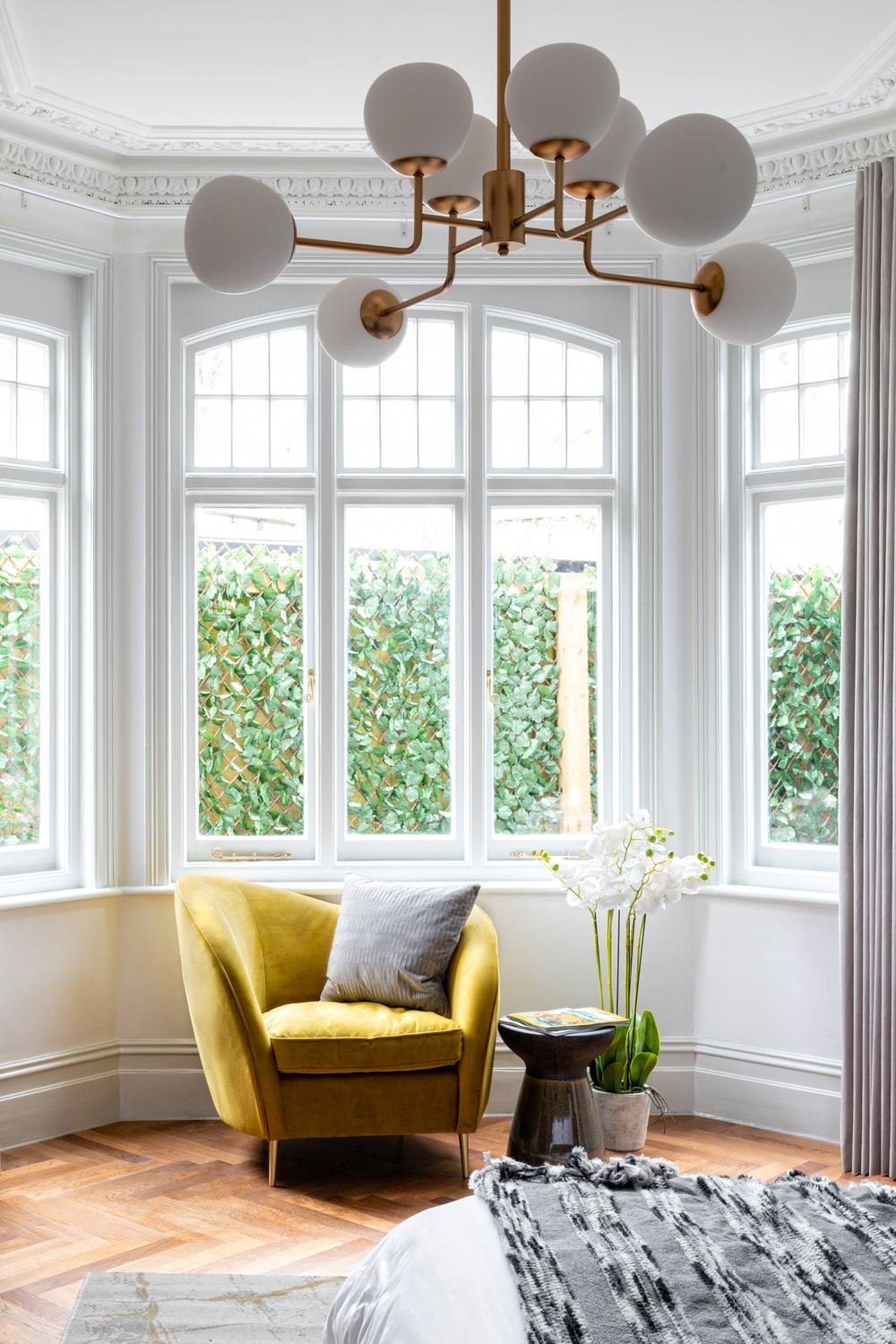 The Chalk Lane Residences show home bay window with yellow armchair, Epsom — styled by HDEY