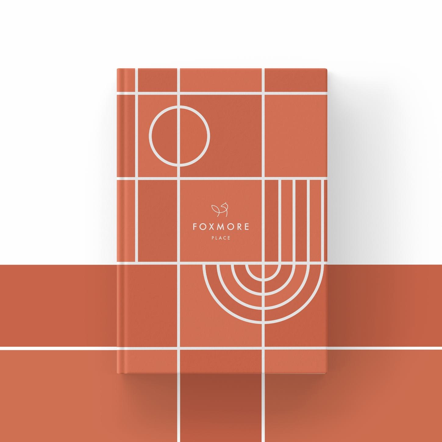 Foxmore Place brochure cover in white with terracotta grid detailing, print design by HDEY