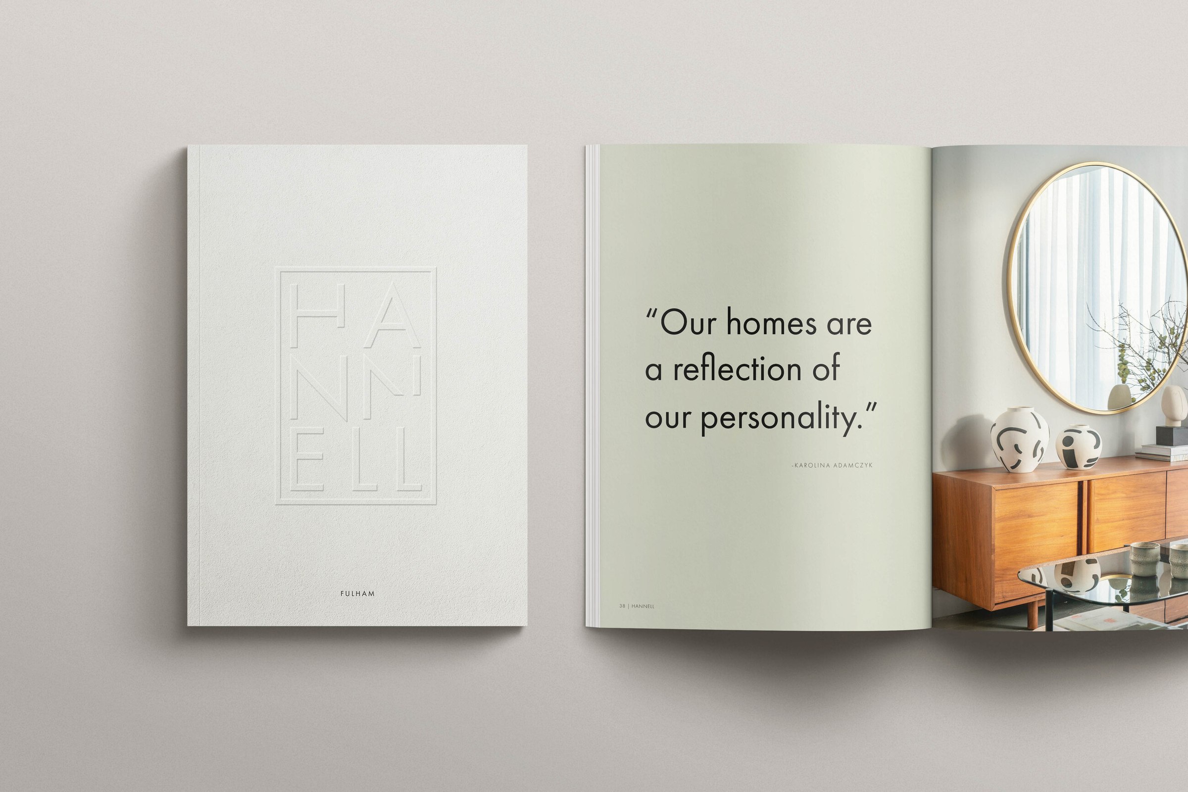Hannell House brochure cover with blind-embossed monogram beside a quote spread, Fulham, print design by HDEY