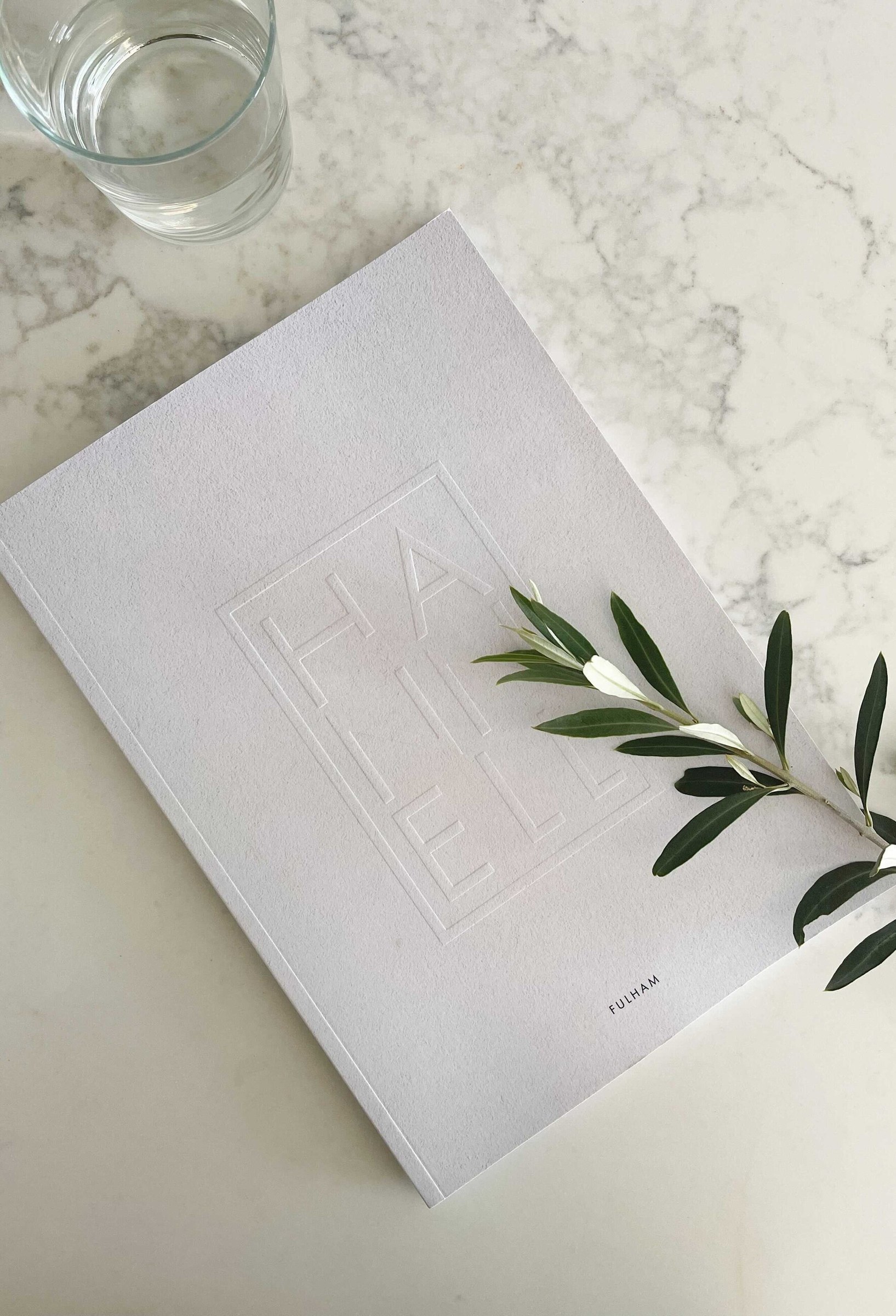 Hannell House brochure cover in blind emboss on textured stock, Fulham, print design by HDEY