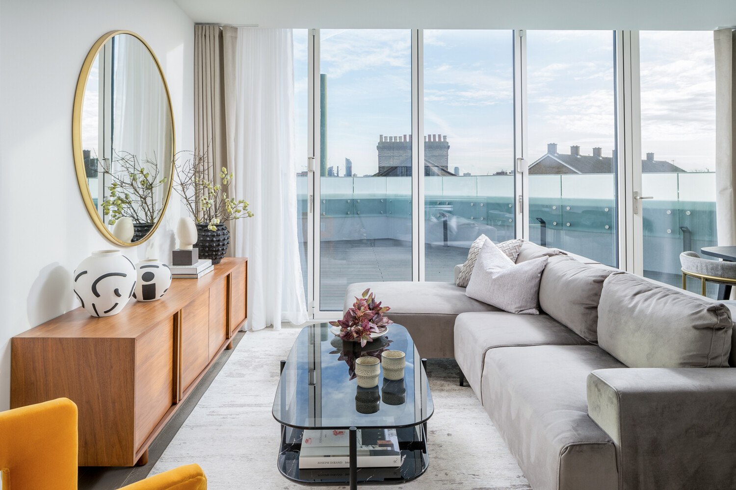 Hannell House show home living room with terrace doors and London rooftops beyond, Fulham, by HDEY