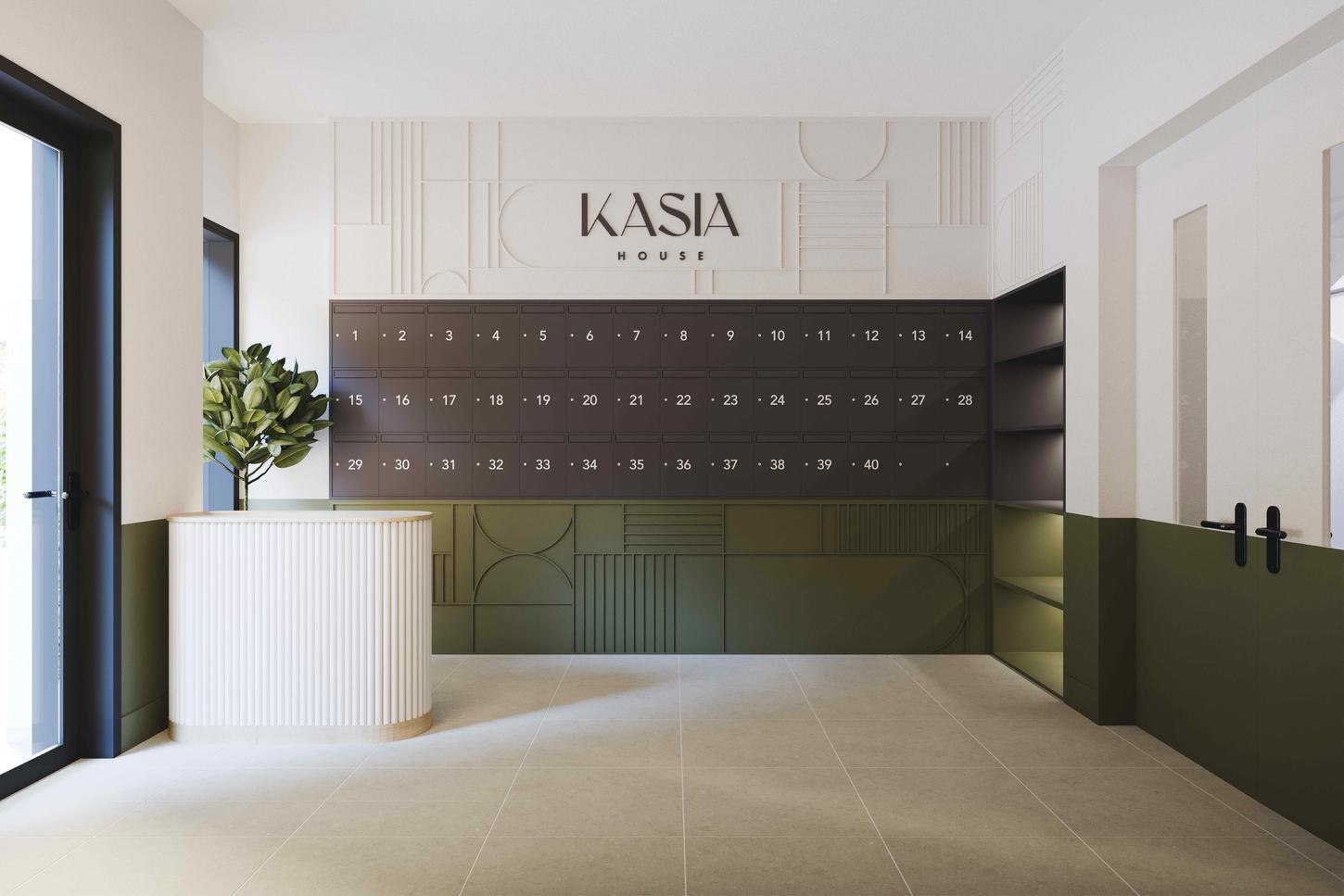 Kasia House communal entrance with the logo above a bank of post boxes and olive green joinery, Chertsey — by HDEY