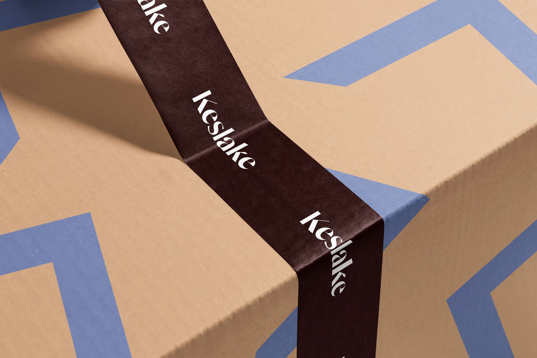 Keslake Place branded packaging and ribbon in tan, brown and soft blue, Reading — branding by HDEY
