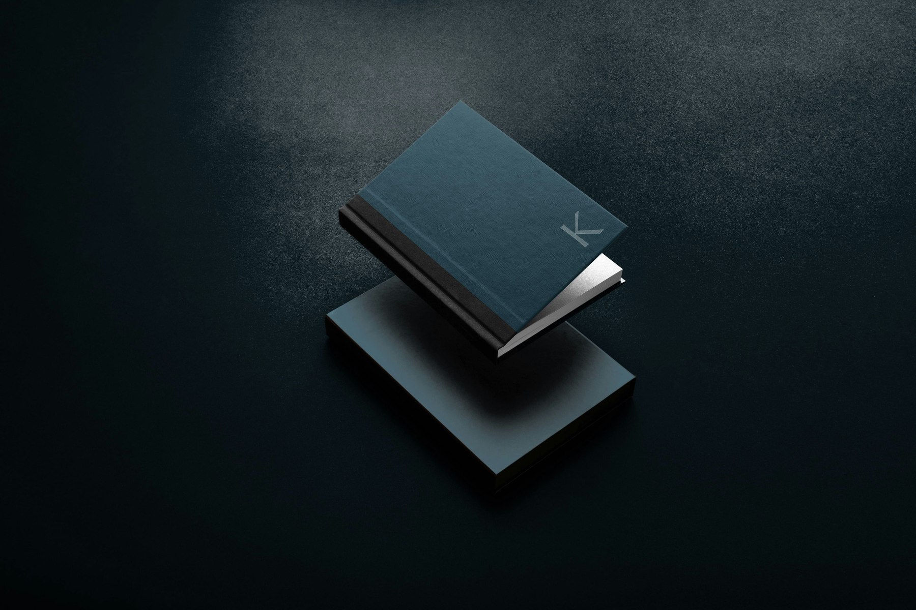 Kings Oak brand guidelines bound in petrol blue cloth with the K monogram foiled on the cover, brand identity by HDEY