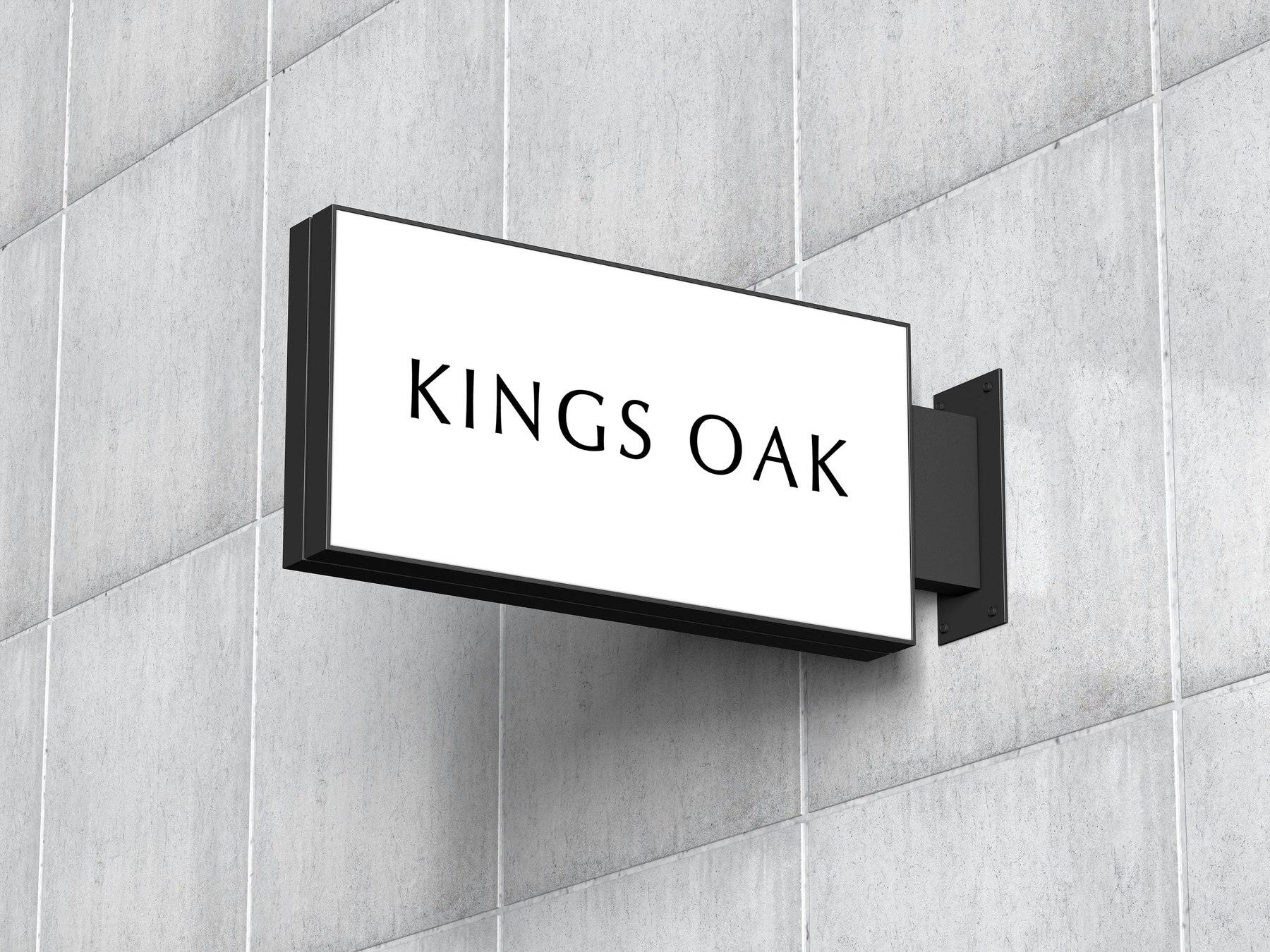 Kings Oak projecting sign in white with the logotype in black, mounted on a stone facade, signage design by HDEY