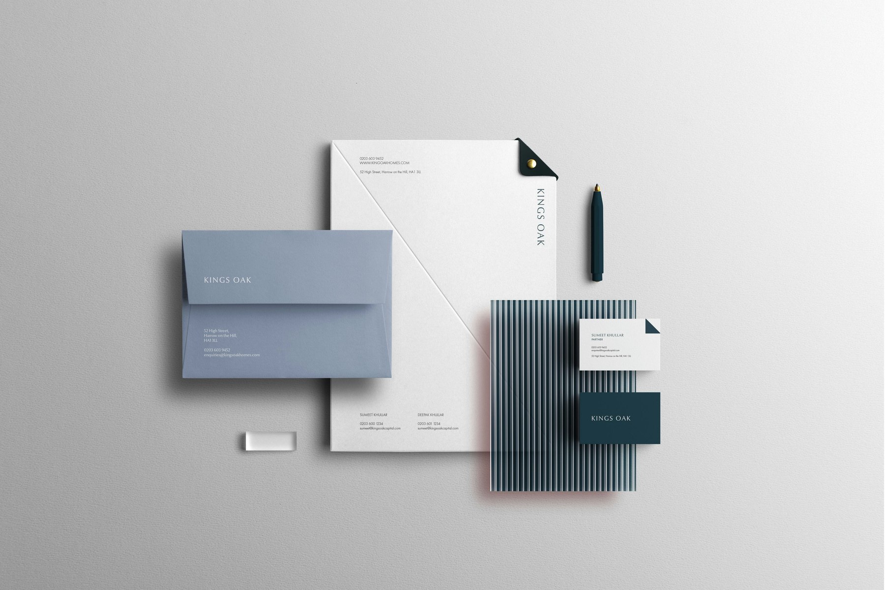 Kings Oak stationery set — letterhead, envelope, business cards and a striped document cover in petrol blue and off-white, brand identity by HDEY
