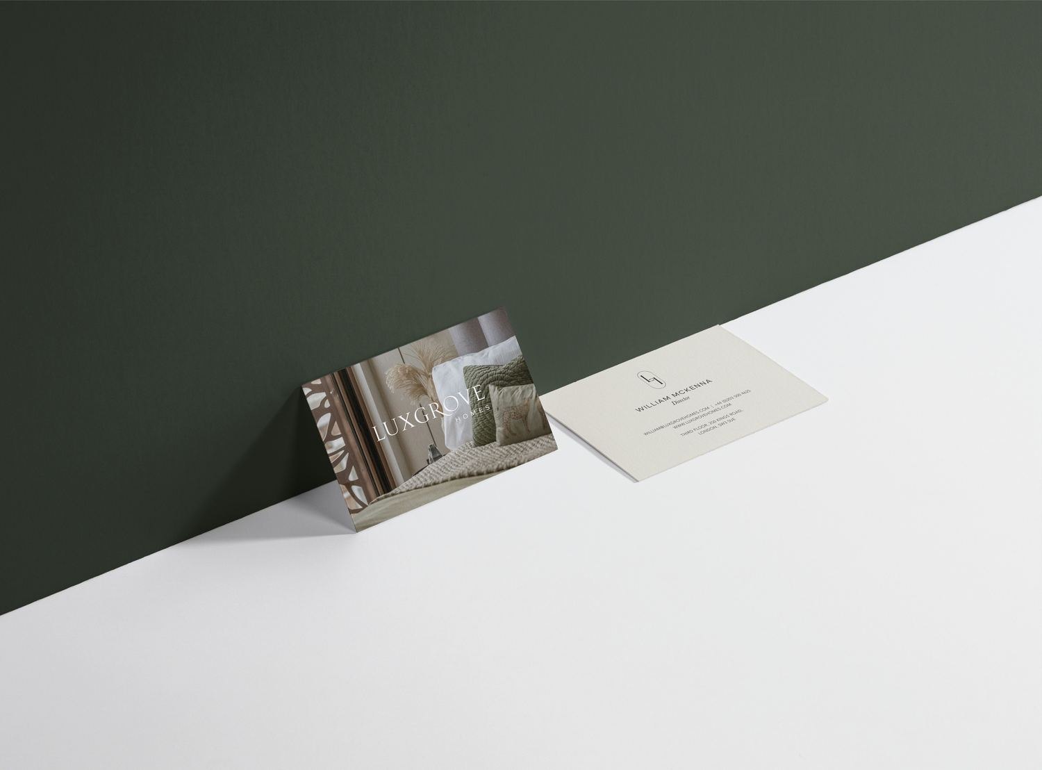 Luxgrove Homes business cards on an olive ground — brand assets by HDEY