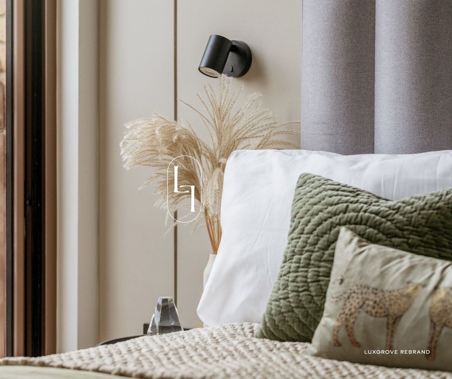Luxgrove Homes rebrand film still with the logomark over an interior — by HDEY