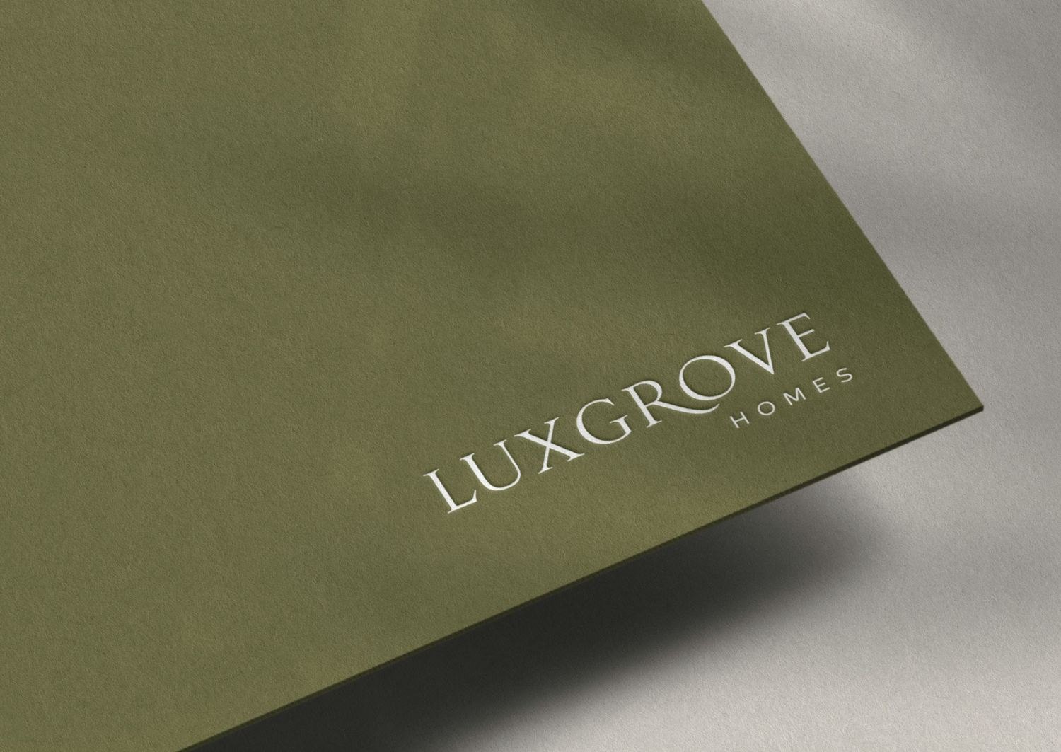 Luxgrove Homes wordmark on paper — brand identity by HDEY