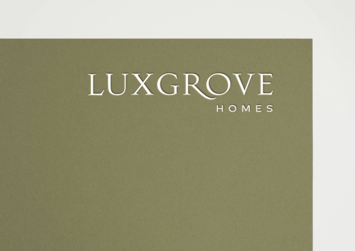 Luxgrove Homes wordmark in a fine serif, cream on olive green — logo design by HDEY