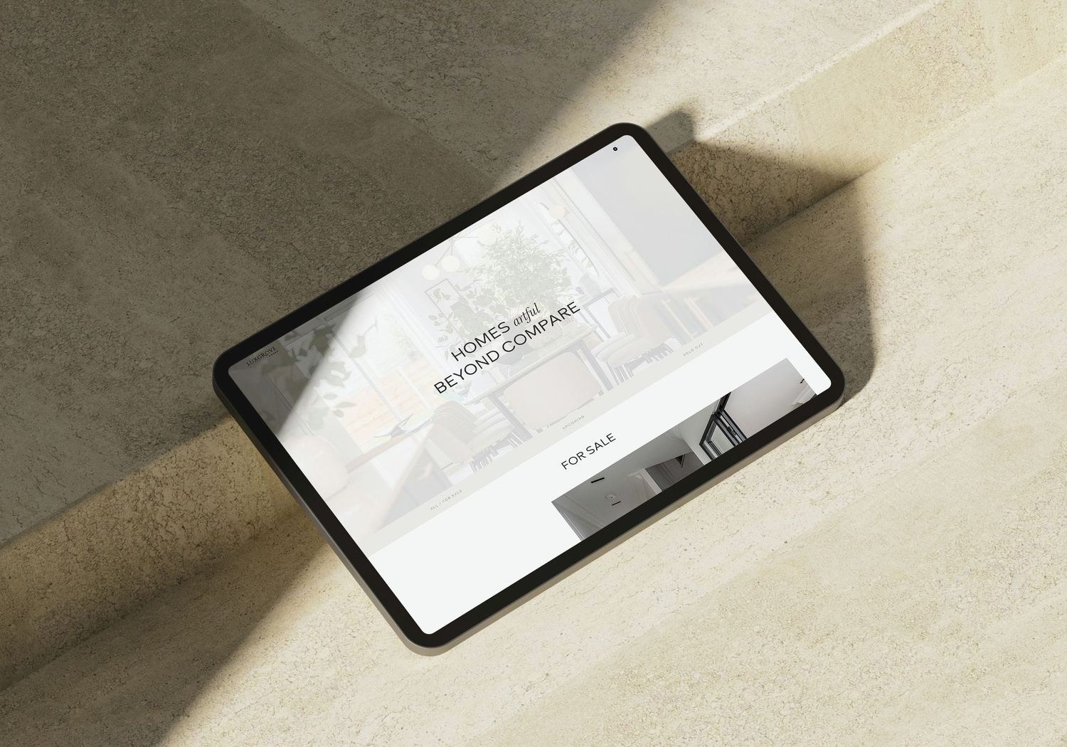 Luxgrove Homes website scheme page shown on a tablet — web design by HDEY