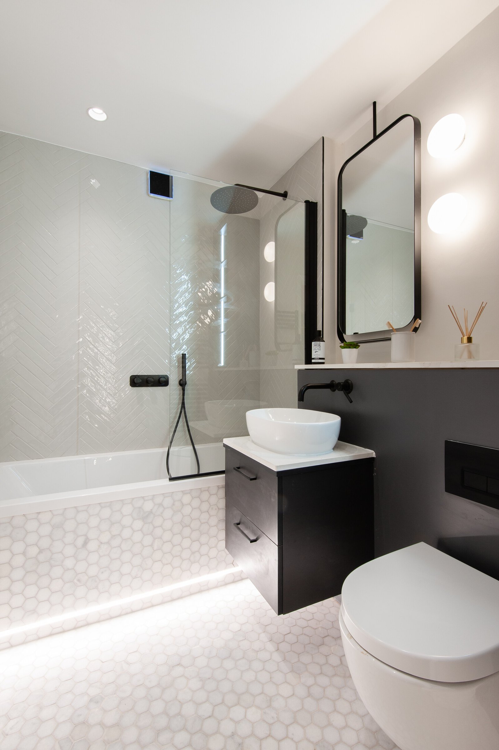 Market Place bathroom with backlit mirror and hexagonal floor tile, Acton, by HDEY