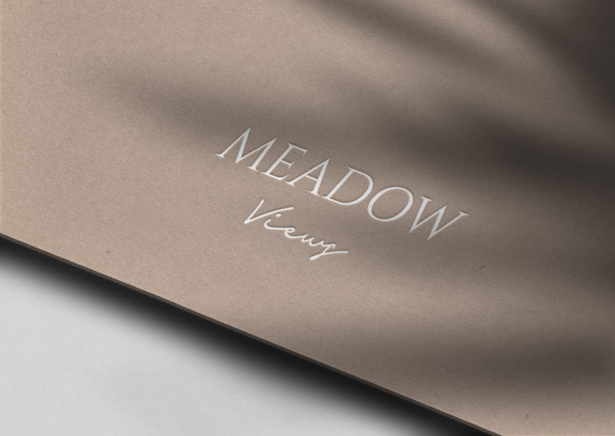 Meadow Views brochure cover — serif and script wordmark, brand identity by HDEY