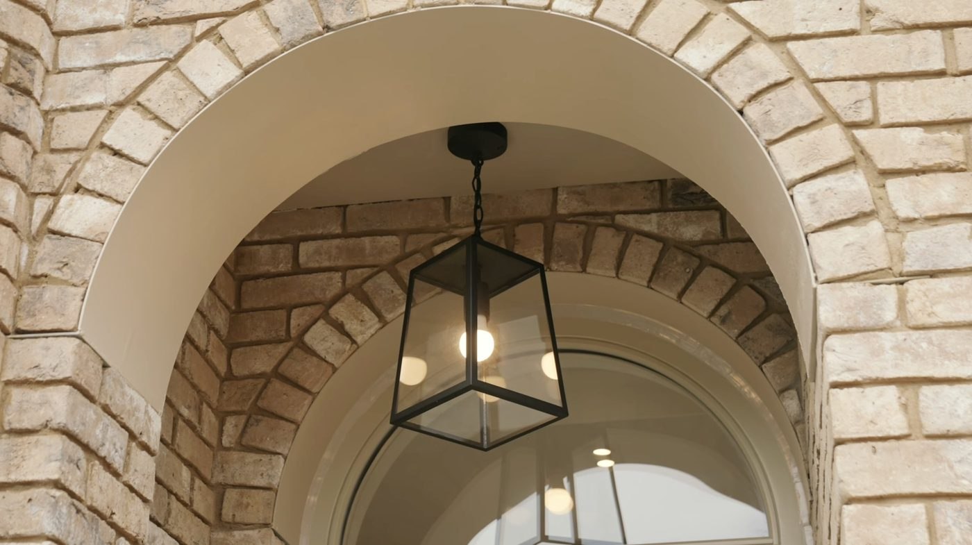 Montpelier Mews exterior brick arch with pendant light, Ealing — development designed by HDEY