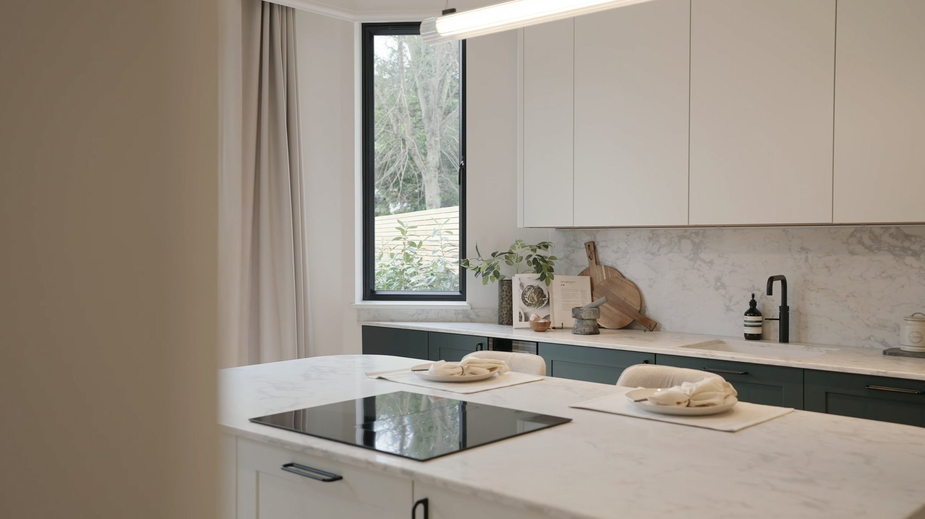 Montpelier Mews kitchen with marble splashback and green cabinets, Ealing — interior design by HDEY