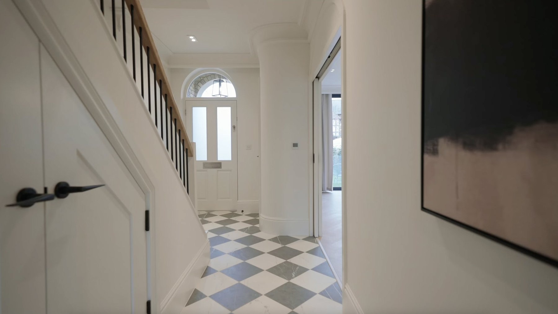 Montpelier Mews entrance hallway with a marble-look checker floor and arched window, Ealing — interior design by HDEY