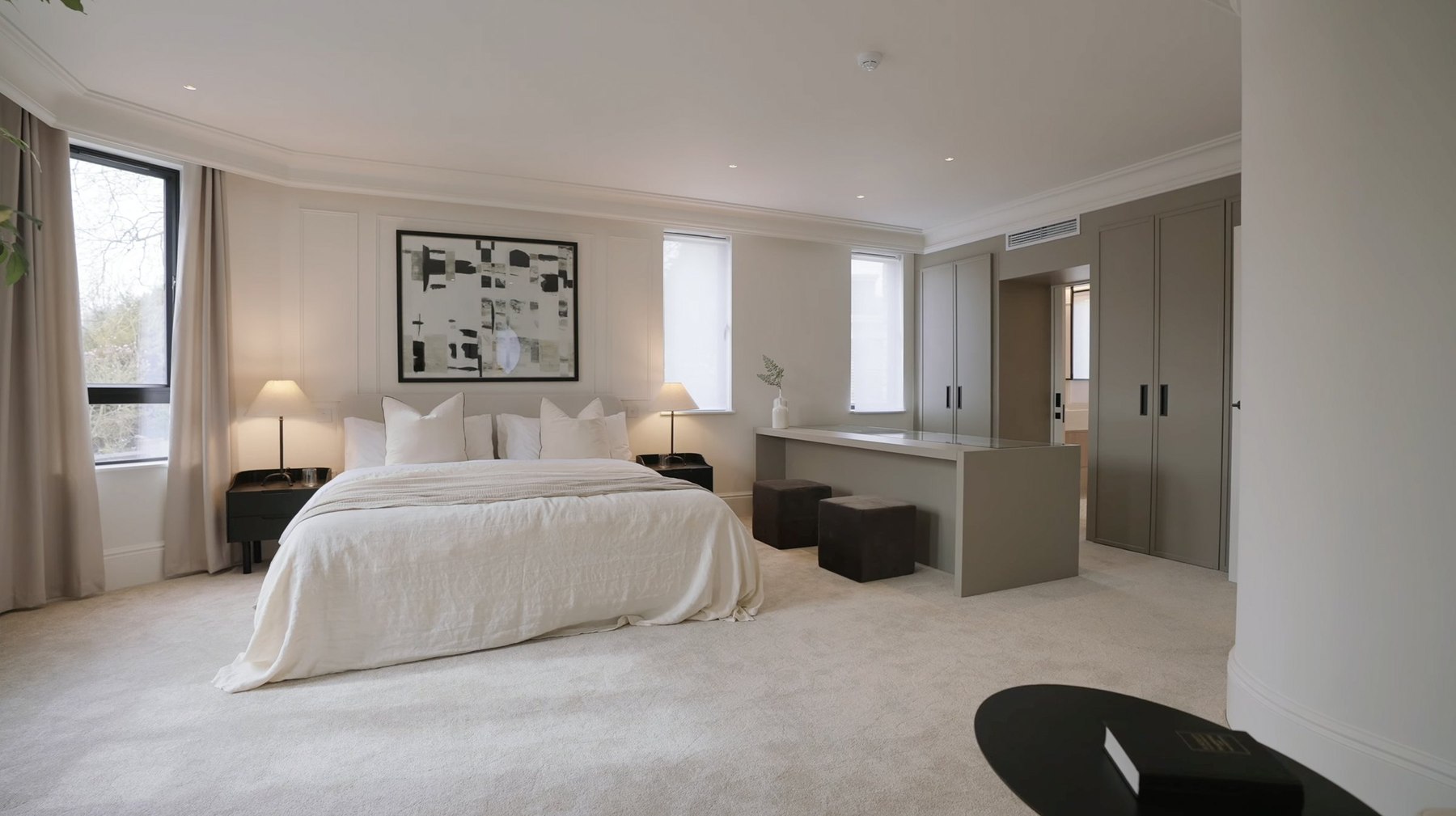 Montpelier Mews primary bedroom with wall panelling and artwork, Ealing — designed by HDEY