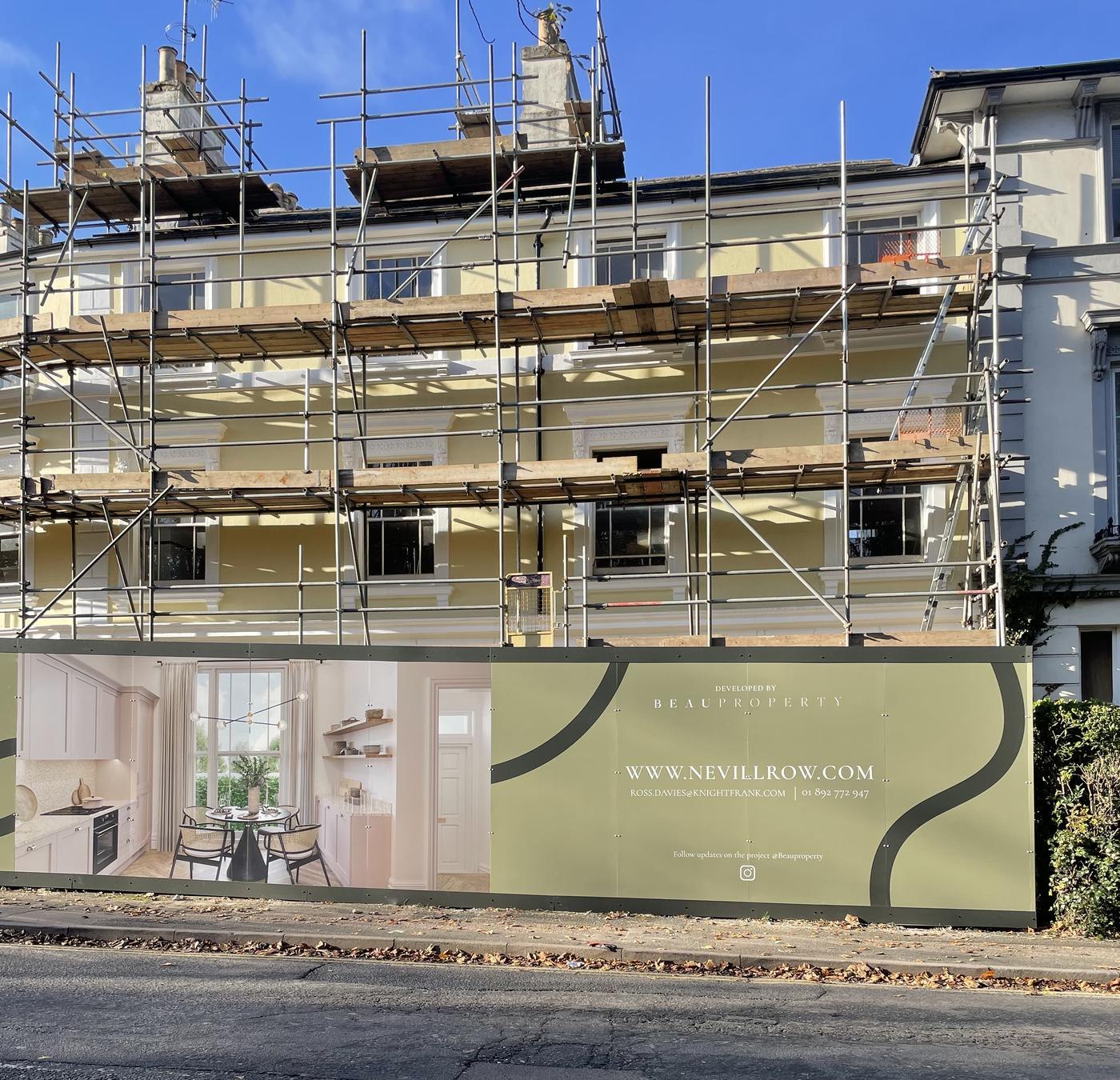 Nevill Row hoarding wrapping the scaffolded terrace with the development branding, Royal Tunbridge Wells — by HDEY