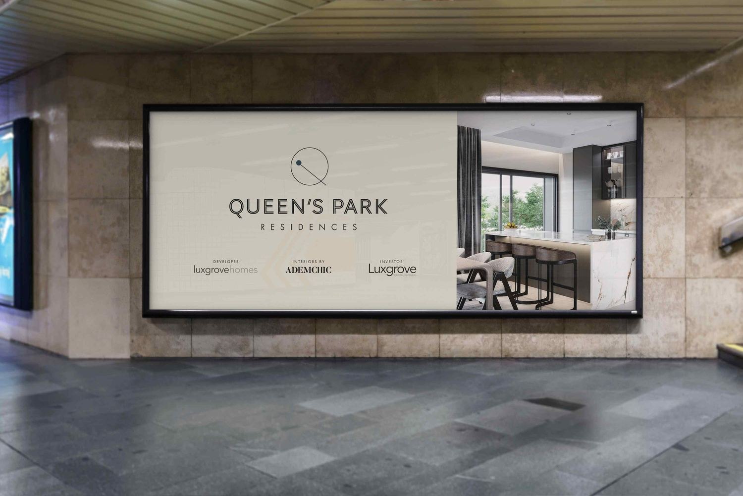 Queen's Park Residences hoarding with the development mark, Luxgrove Homes and Ademchic credits, NW6 — by HDEY