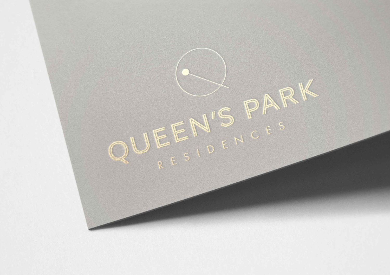 Queen's Park Residences logo in gold on a warm grey cover, brand identity by HDEY