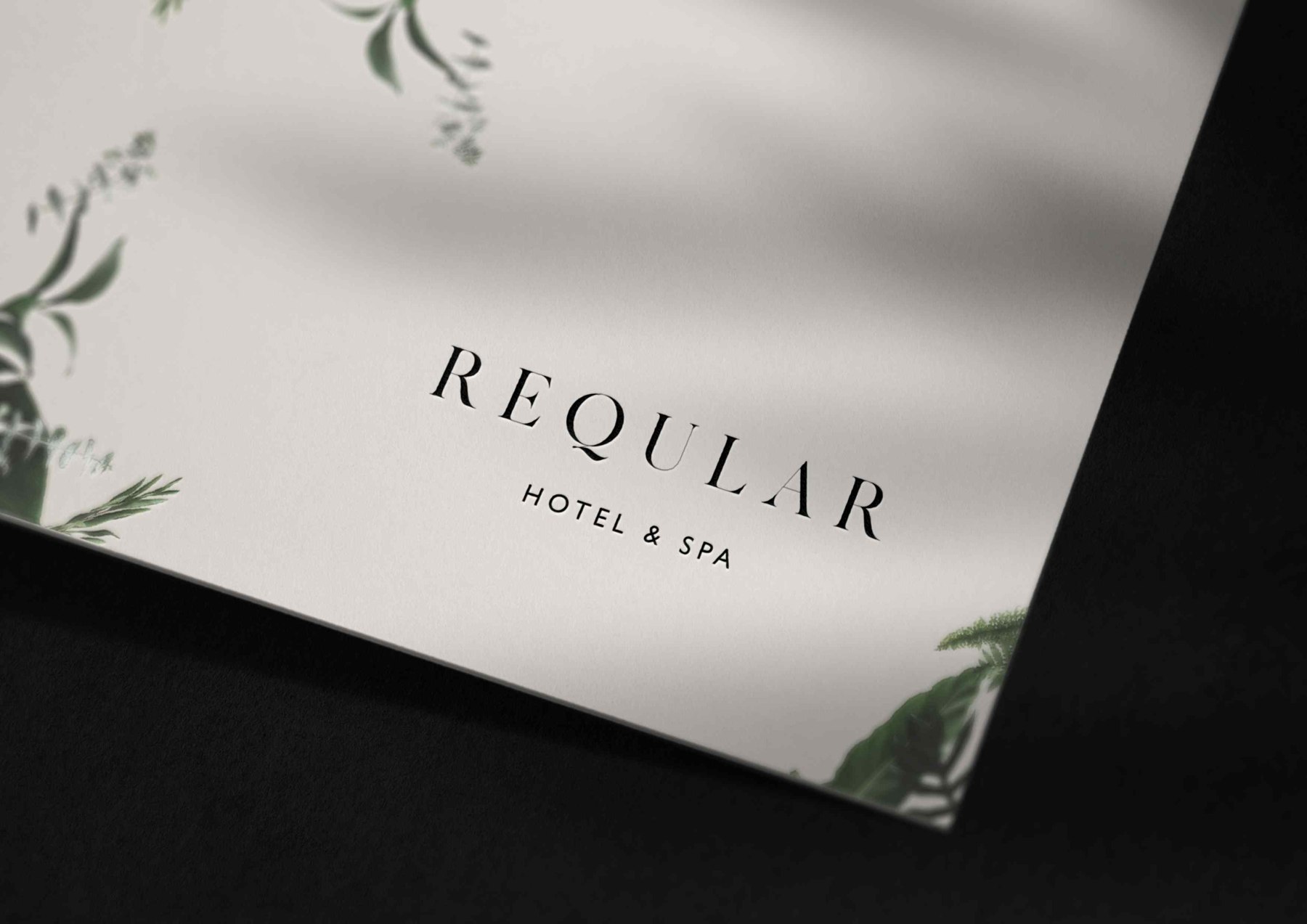 Reqular print collateral in warm off-white with the logotype and botanical illustration at the corners, print design by HDEY