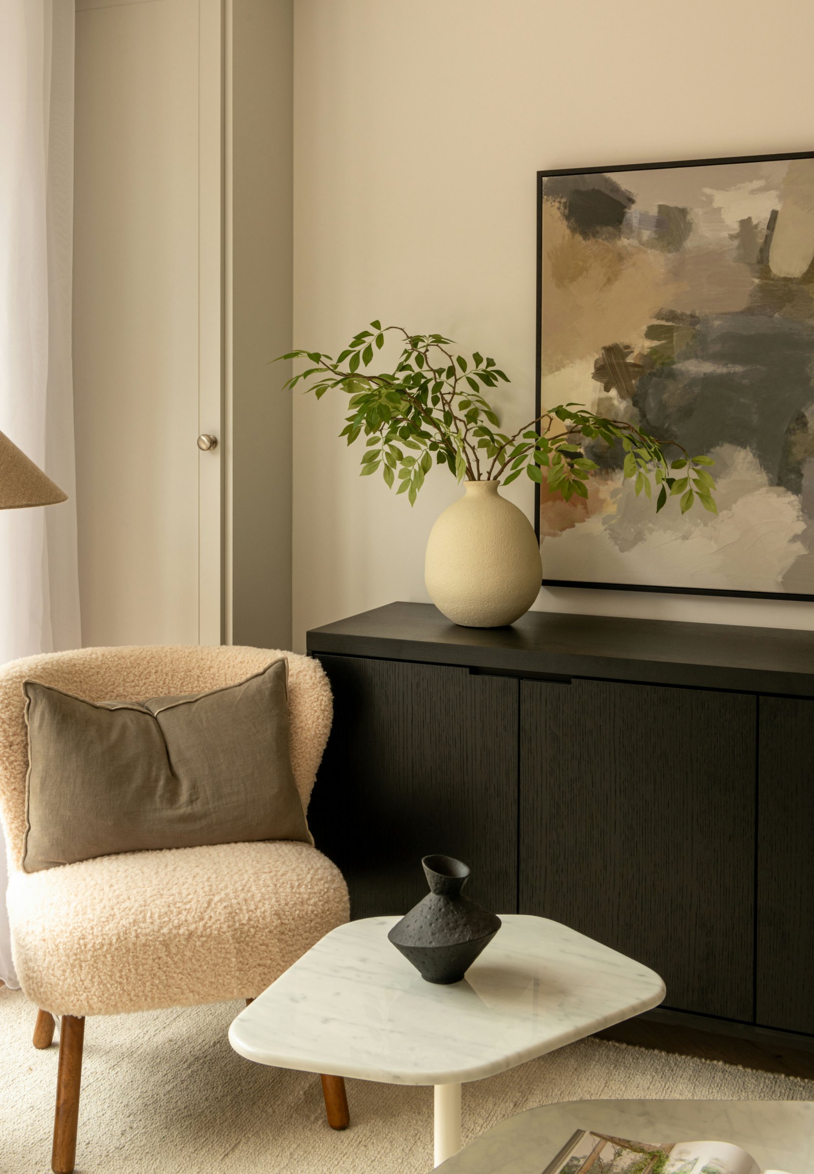 Robson Road show home living room corner with sideboard and armchair, West Dulwich, styled by HDEY