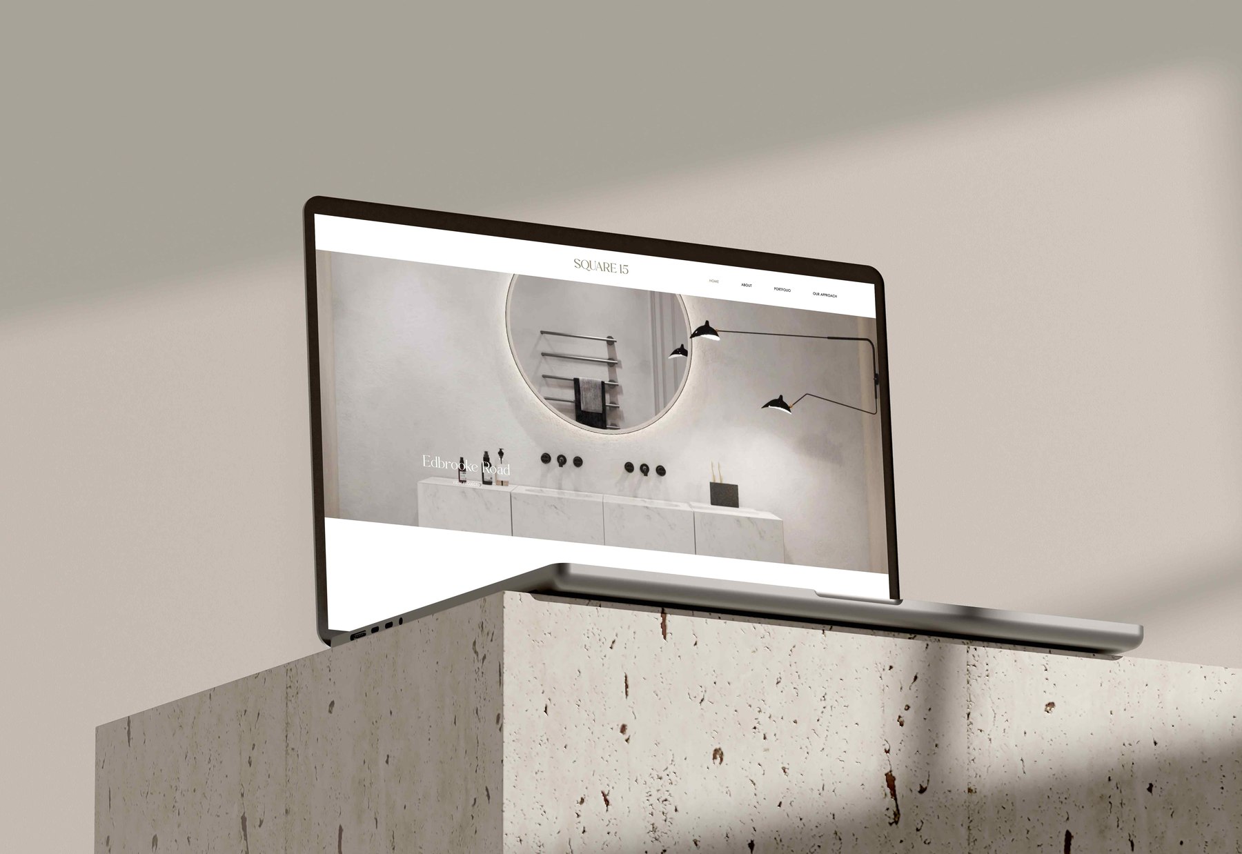 Square 15 website homepage shown on a laptop, with the new photography of a stone bathroom and the navigation across the top, web design by HDEY