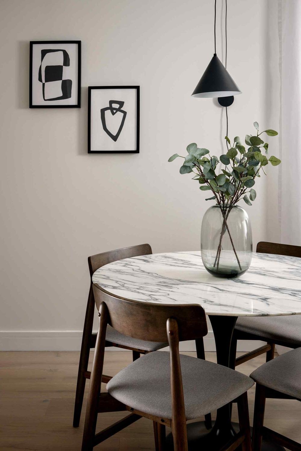 14 St Peter's Road show home dining area with marble table and artwork, Croydon — show home styled by HDEY