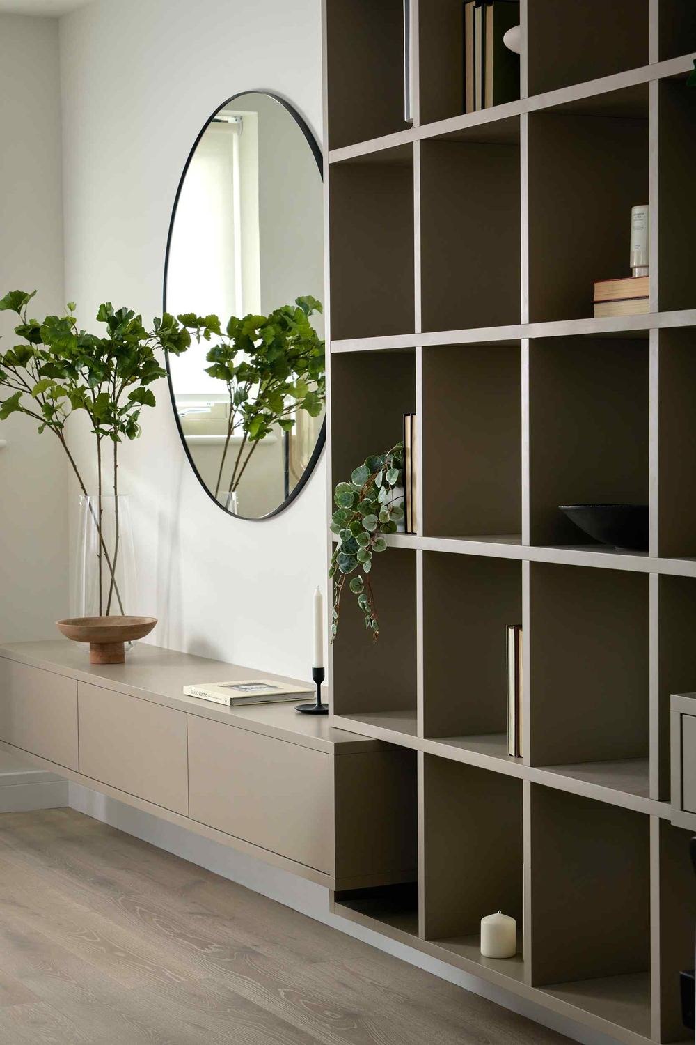 14 St Peter's Road show home with full-height olive shelving and round mirror, Croydon — show home styled by HDEY