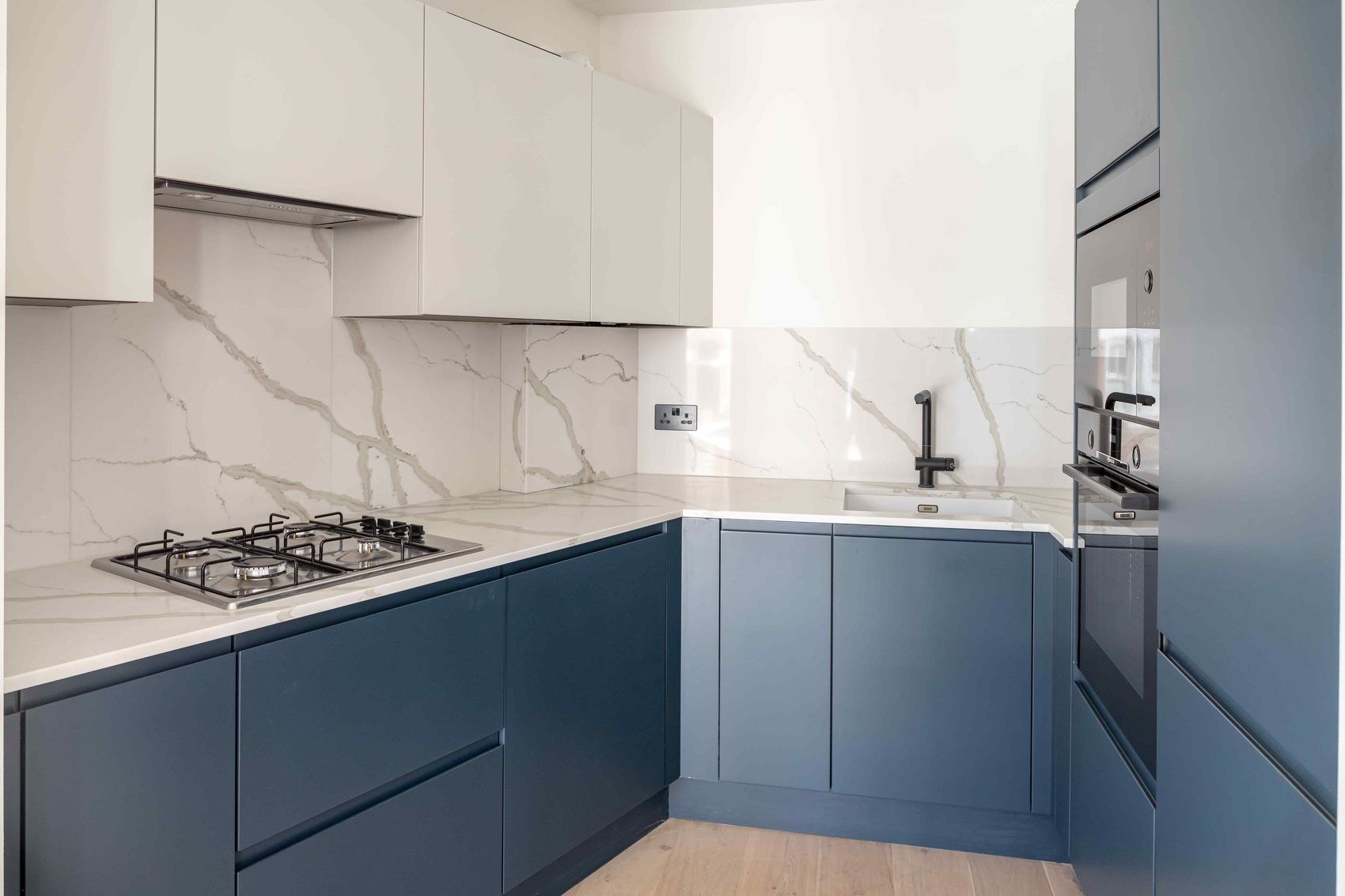 Streatley Road kitchen with navy cabinetry and marble splashback, London, interior design by HDEY
