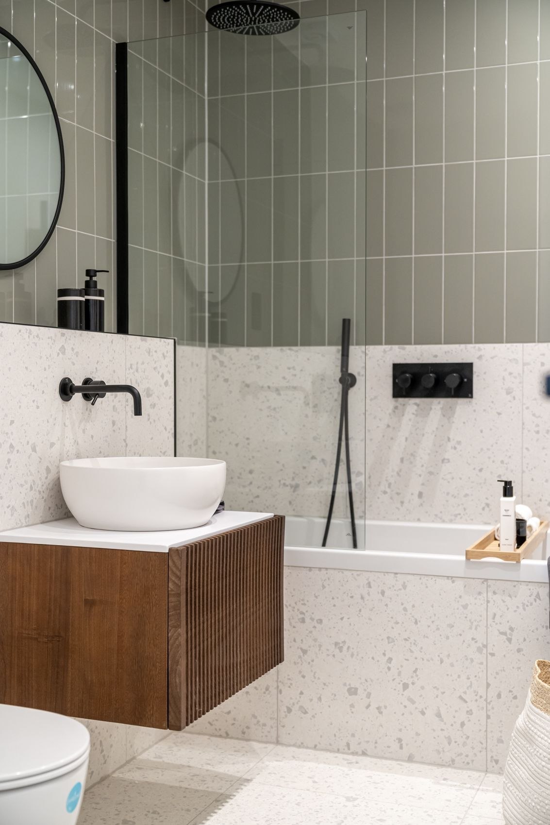 Streatley Road bathroom vanity in fluted walnut with a round basin, London, specification by HDEY