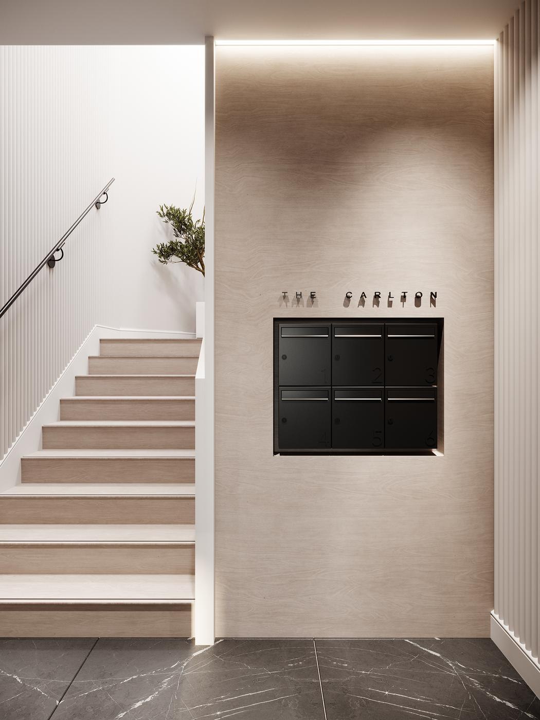 The Carlton communal stair with the development name set into the wall and built-in post boxes, Ealing — by HDEY