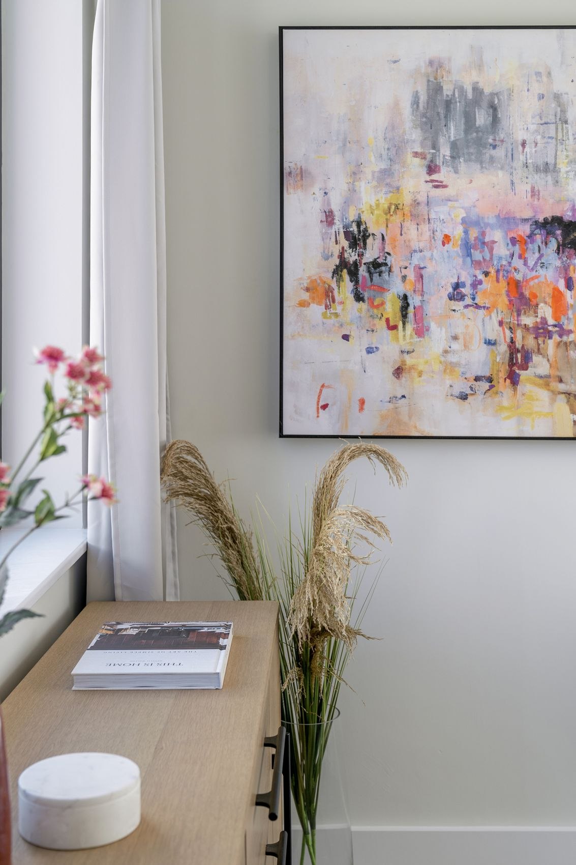 The Old Exchange show home with abstract artwork above an oak console, Kingswood, Bristol, by HDEY