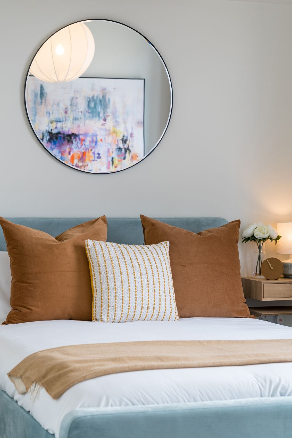 The Old Exchange show home bedroom with teal velvet bed and rust cushions, Kingswood, Bristol, by HDEY
