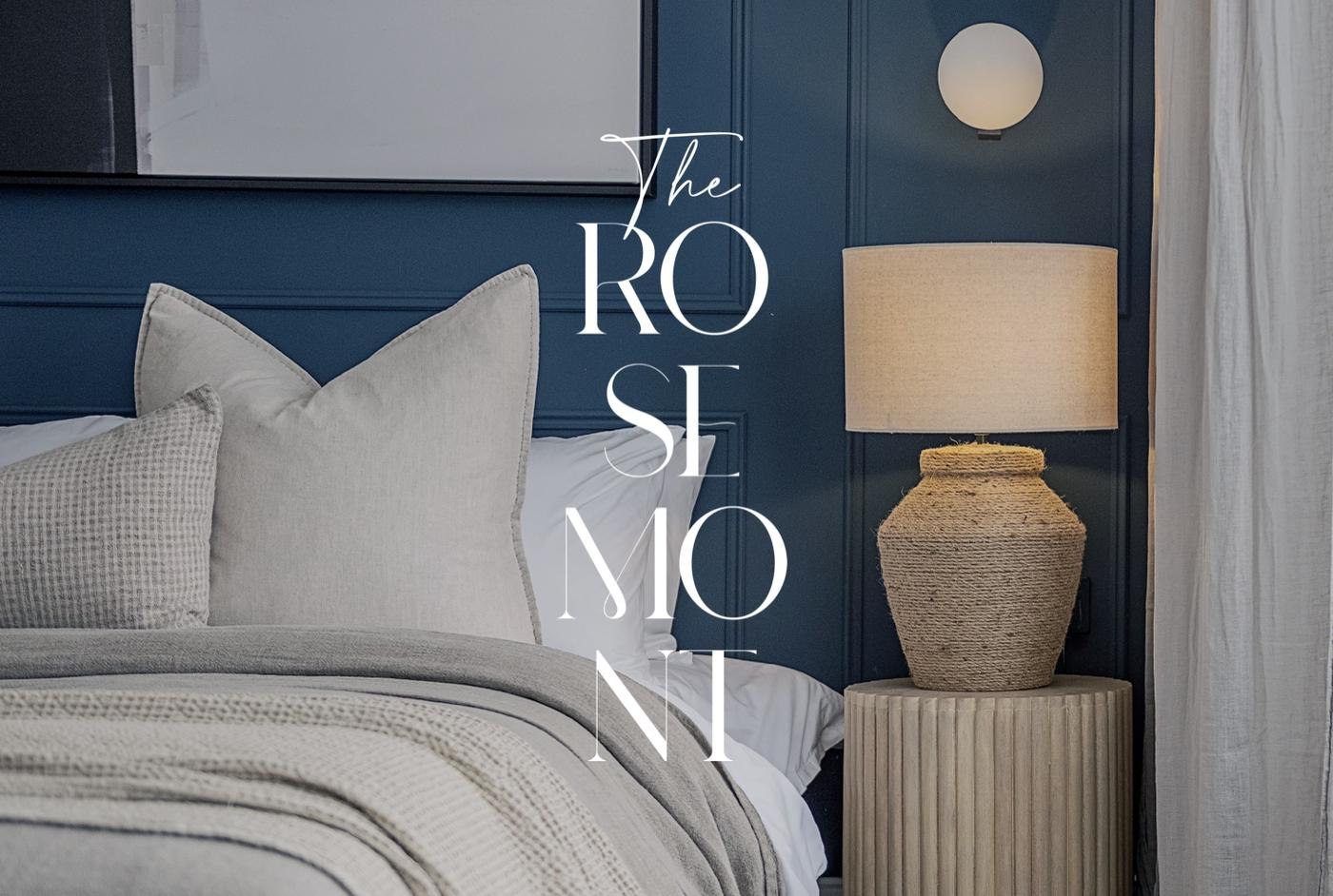 The Rosemont bedroom with deep blue panelling, globe wall light and fluted bedside table, Ealing &mdash; interior design by HDEY