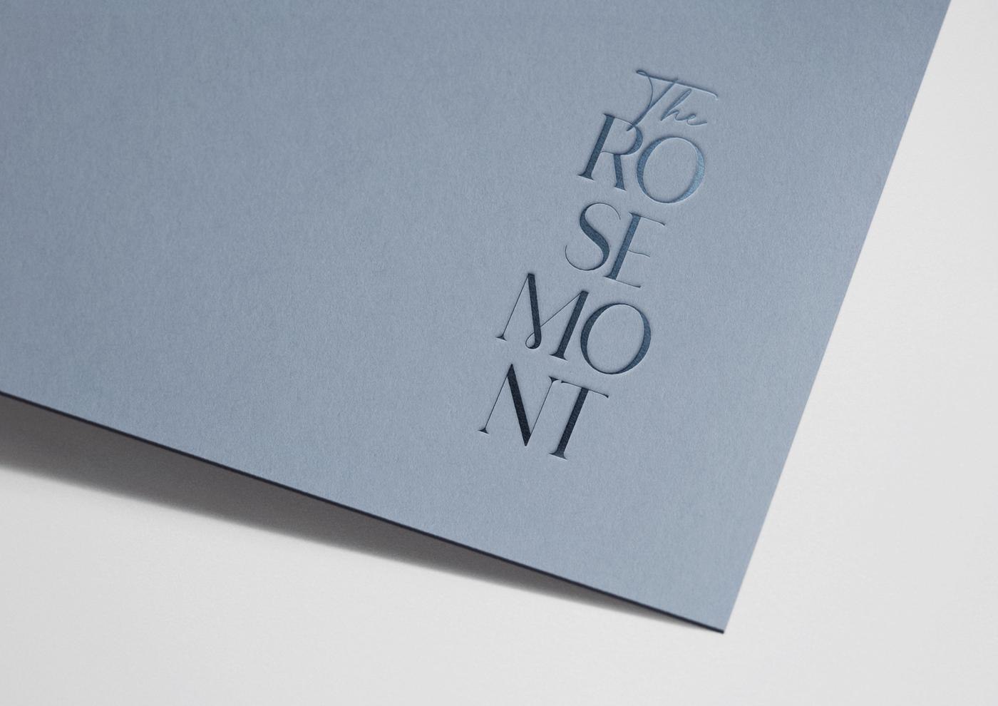 The Rosemont logotype stacked over three lines and debossed in dusty blue, brand identity by HDEY