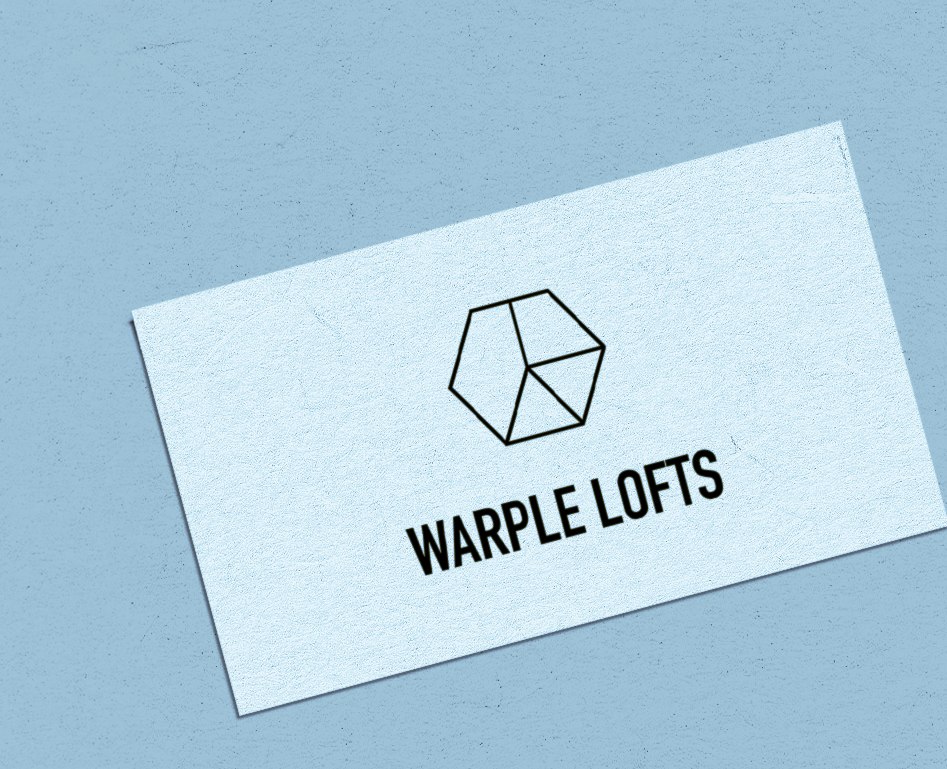 Warple Lofts business card with the hexagon logomark on textured stock, brand identity by HDEY