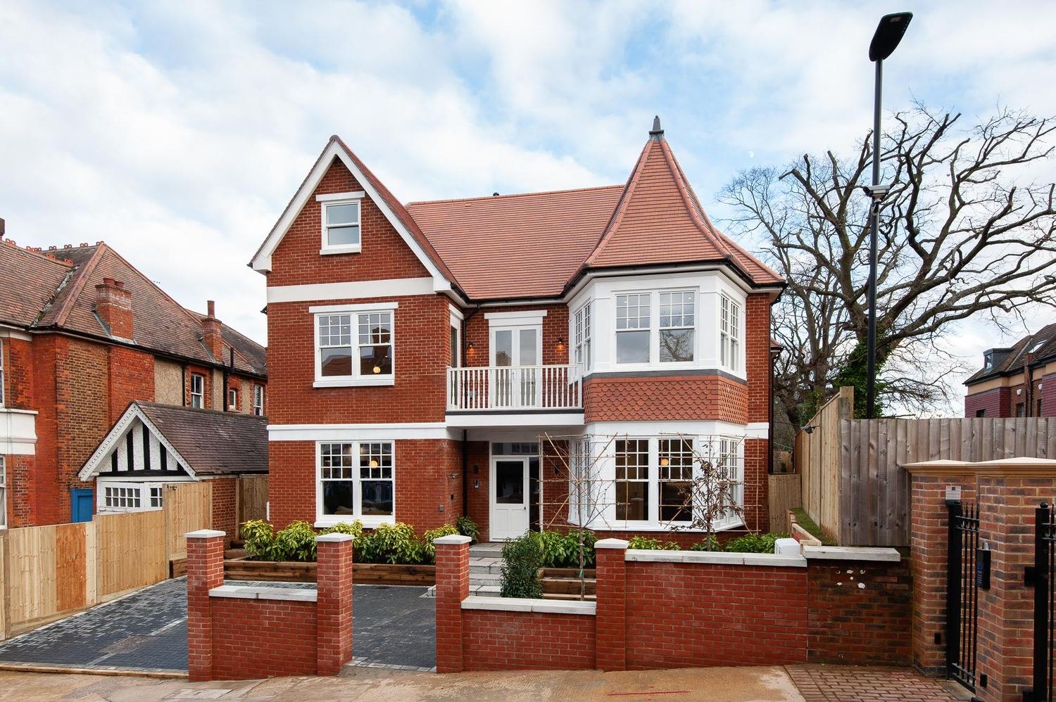 West Lodge exterior, a red brick building on a residential street in Ealing, London