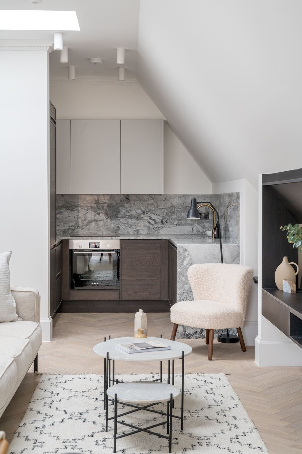 West Lodge top floor living space with kitchenette under the eaves, Ealing — by HDEY