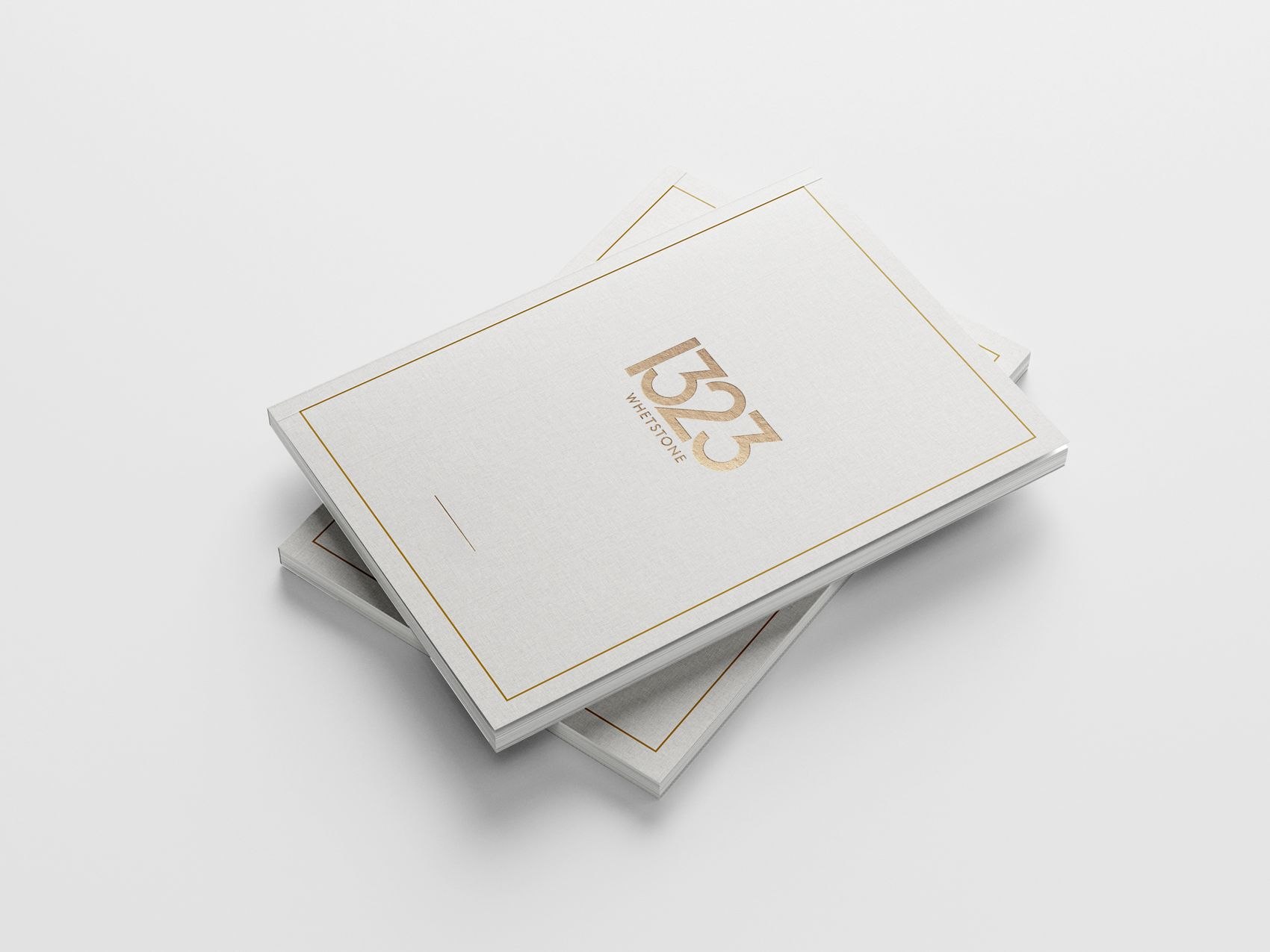 1323 Whetstone brochures stacked, showing the gold rule border, print design by HDEY