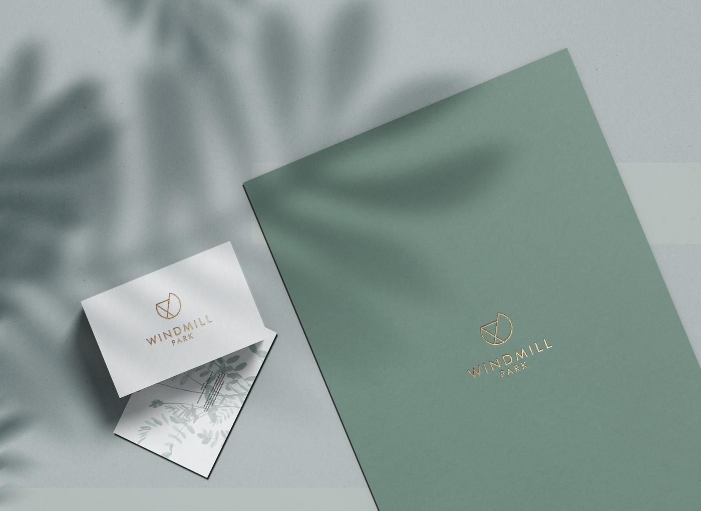 Windmill Park business cards and brochure covers in sage green with gold foil, brand assets by HDEY
