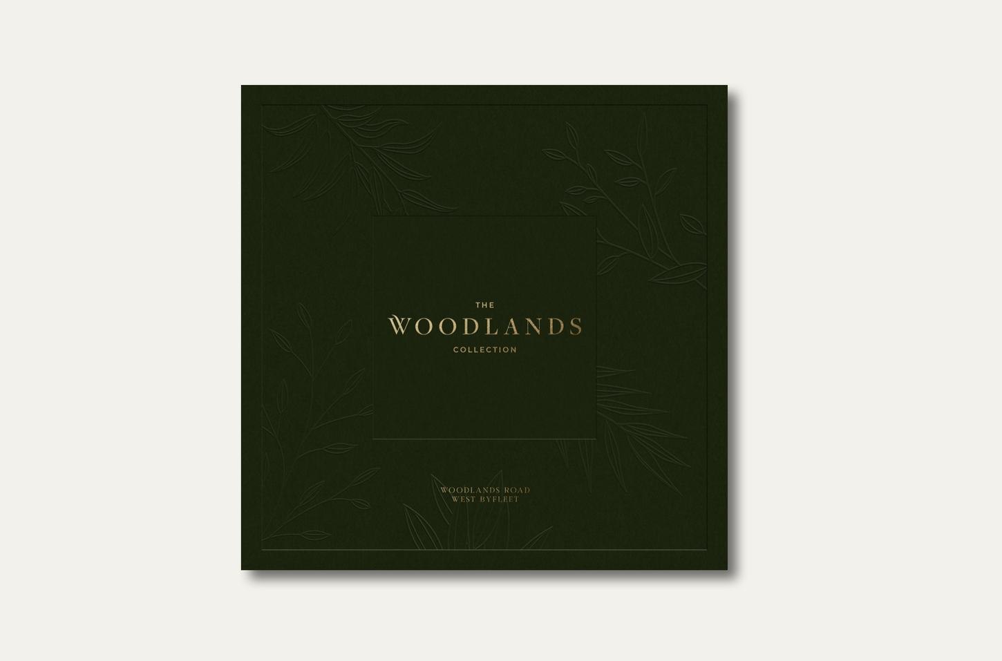 The Woodlands Collection brochure cover in forest green with gold foil, print design by HDEY